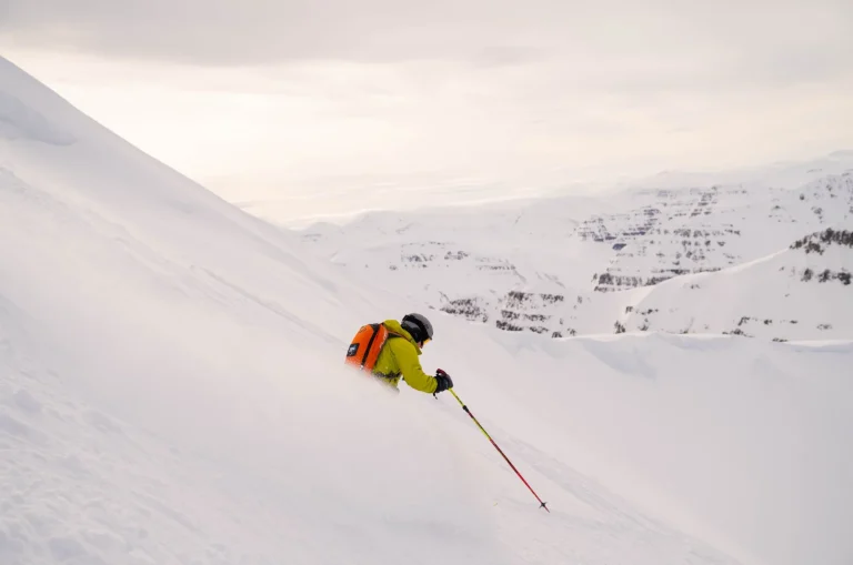 skier carving snowy mountain slope