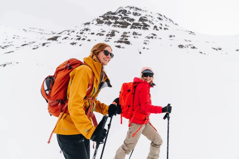women mountain hiking snow